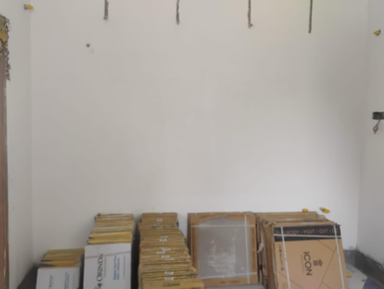 Boards and materials delivered, stacked in a bare room